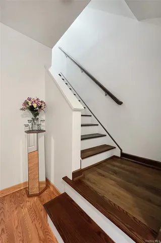 a room with a mirror and a walk in closet