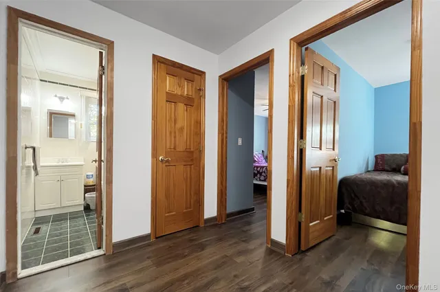 a view of a bedroom from a hallway