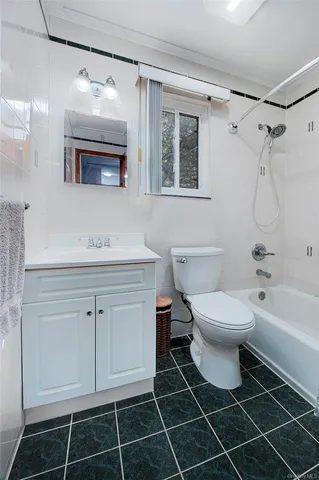 a view of a house with a yard balcony and sitting area