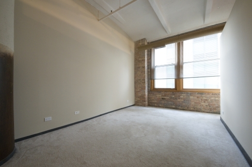 801 South Wells Street, Unit 311 Chicago, IL 60607 - Photo 10 of 16 an empty room with a window