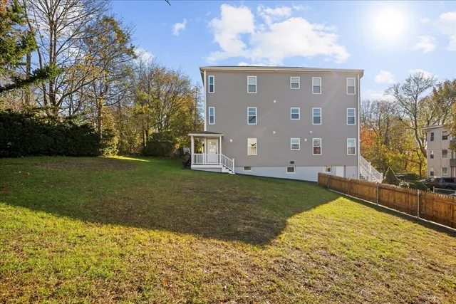a view of a house with a yard
