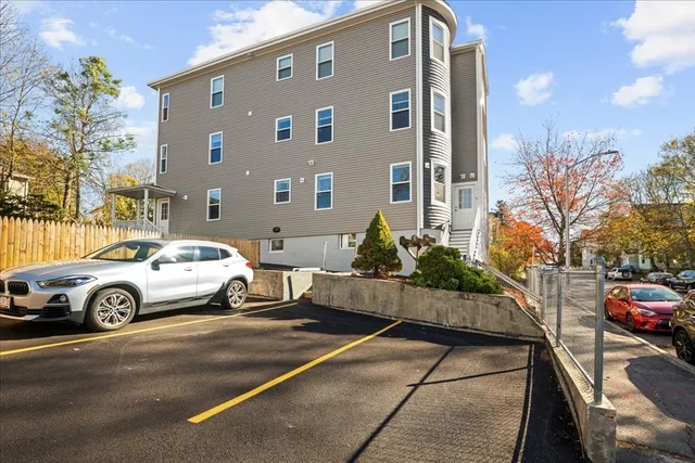 a front view of a house with parking space
