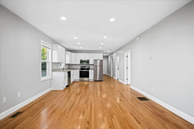 a view of kitchen with wooden floor