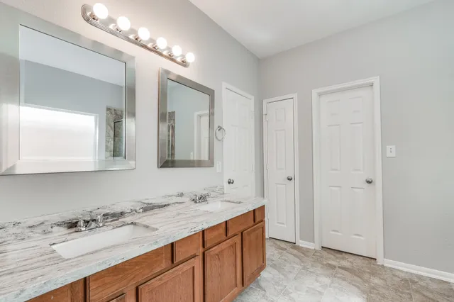 a spacious bathroom with a bathtub and shower