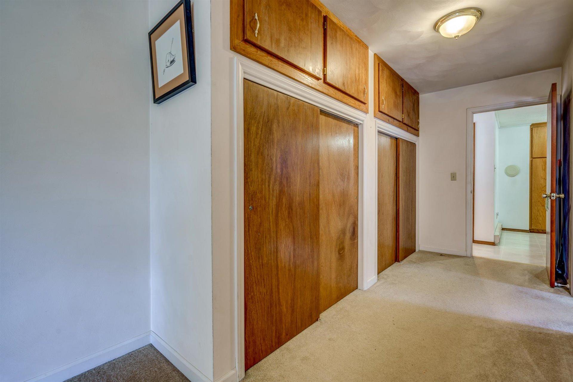 2725 Morgans Mill Road Goodview, VA 24095 - Photo 15 of 49 a view of a hallway with wooden shelves
