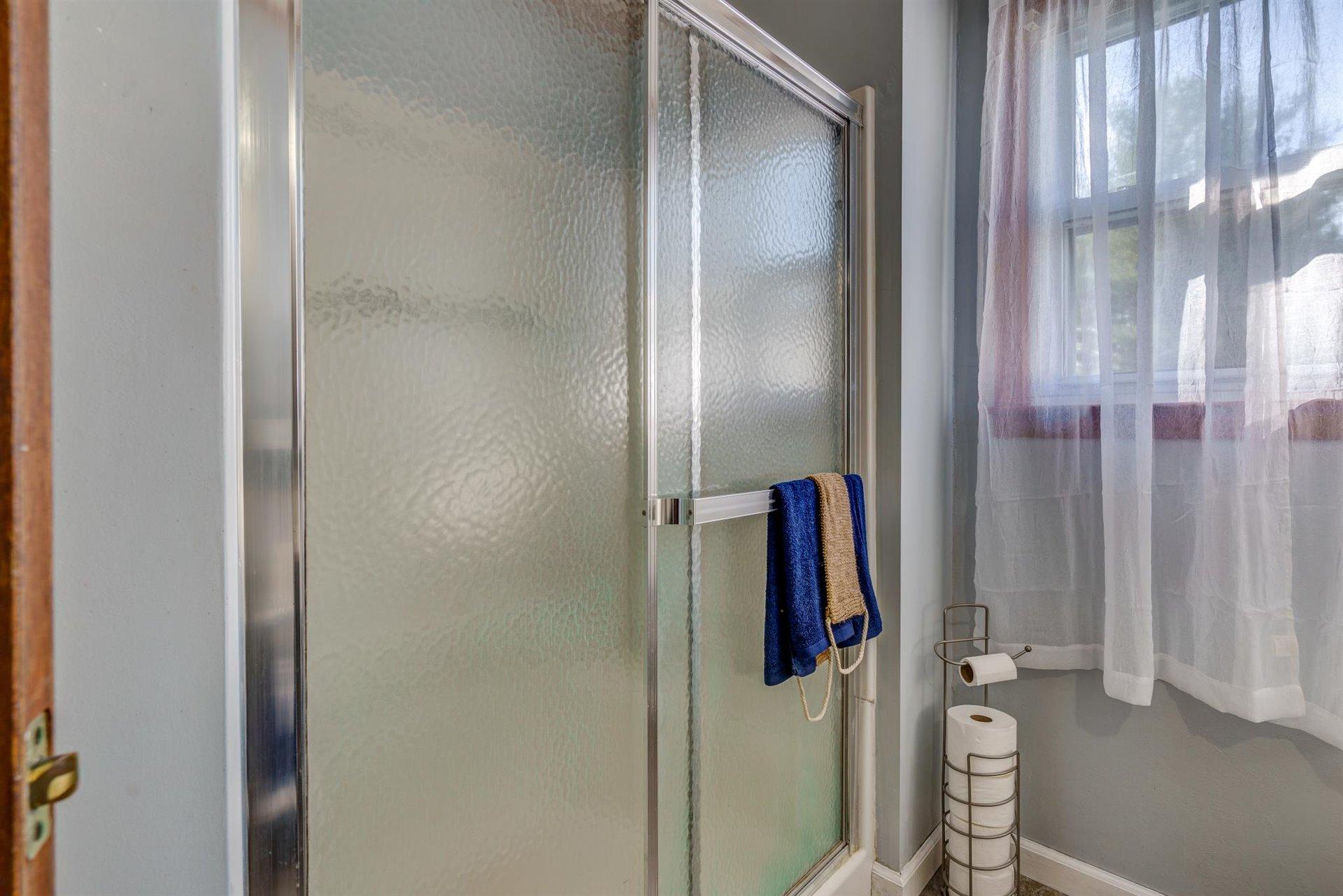 2725 Morgans Mill Road Goodview, VA 24095 - Photo 20 of 49 a bathroom with a shower and a mirror
