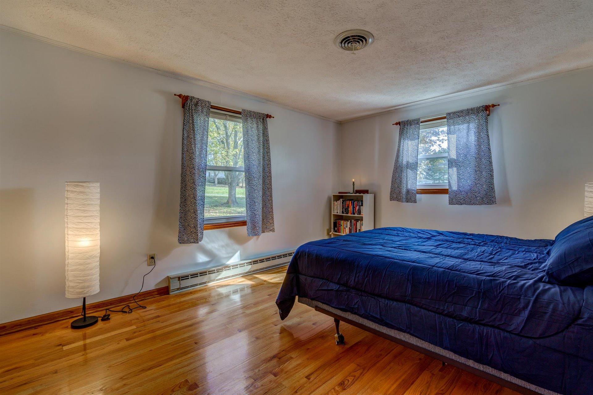 2725 Morgans Mill Road Goodview, VA 24095 - Photo 22 of 49 a bedroom with a bed and window