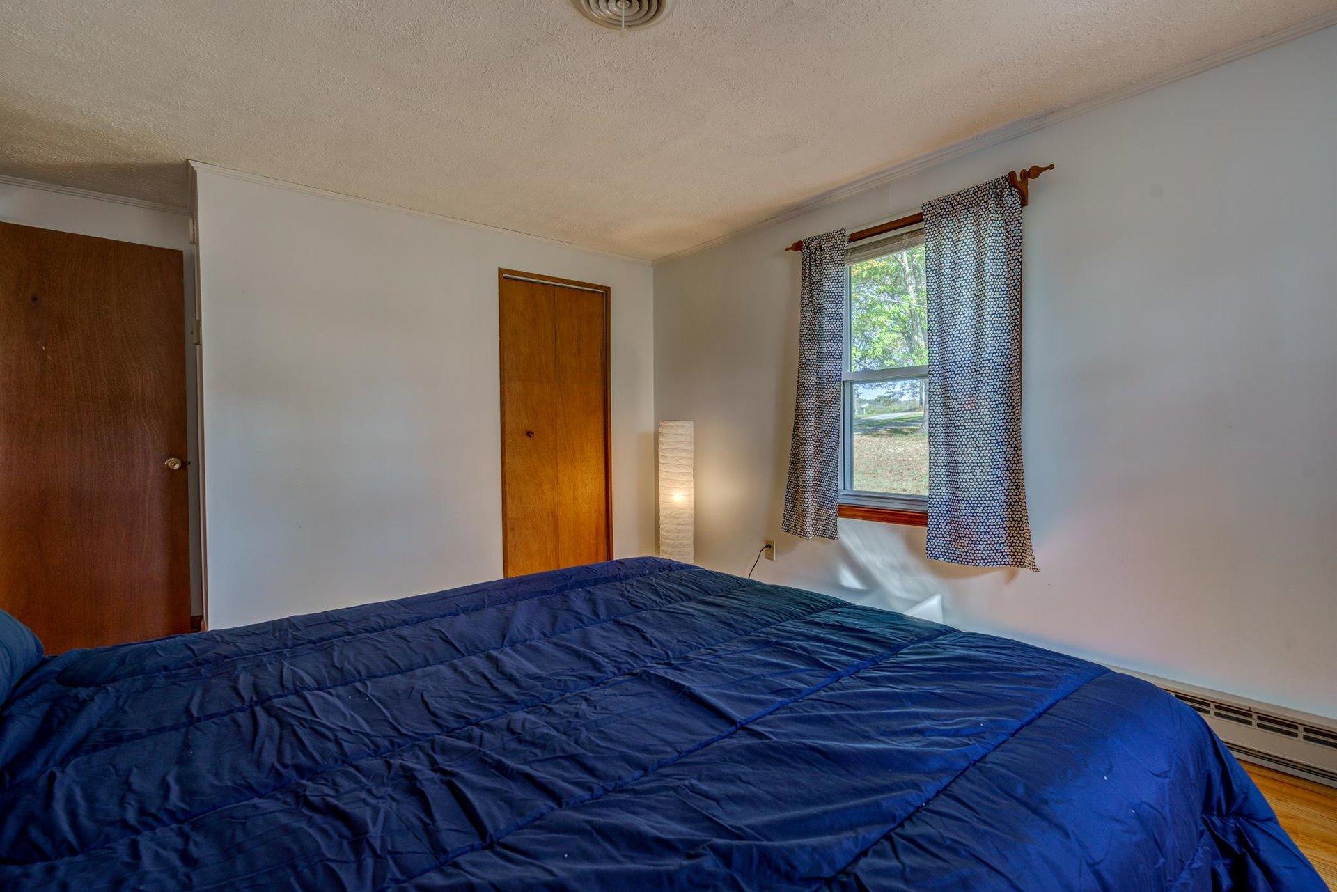 2725 Morgans Mill Road Goodview, VA 24095 - Photo 23 of 49 a view of bedroom with window and hardwood floor