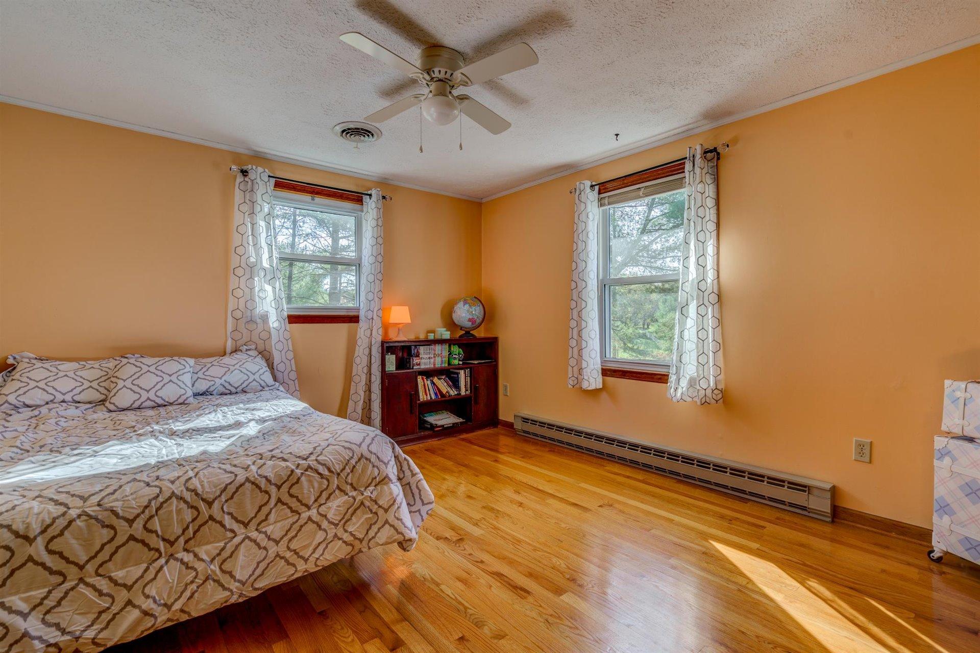 2725 Morgans Mill Road Goodview, VA 24095 - Photo 24 of 49 a bedroom with a bed dresser and a window