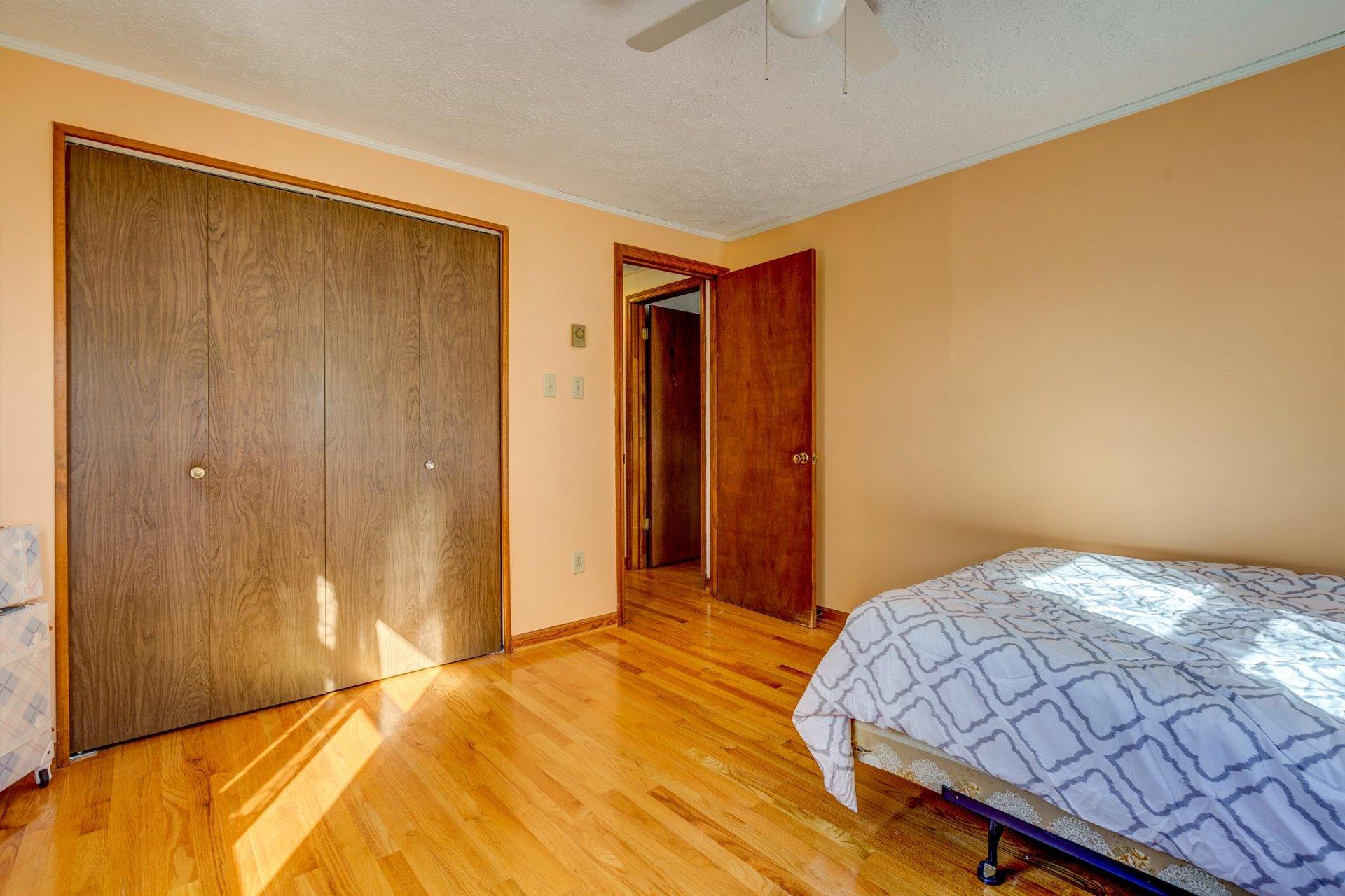 2725 Morgans Mill Road Goodview, VA 24095 - Photo 25 of 49 a bedroom with a bed and a closet