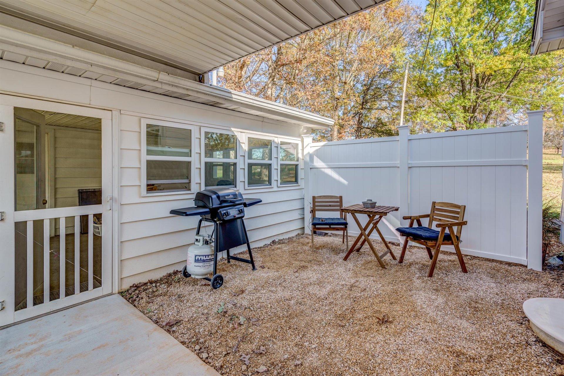 2725 Morgans Mill Road Goodview, VA 24095 - Photo 26 of 49 a view of a house with backyard and sitting area