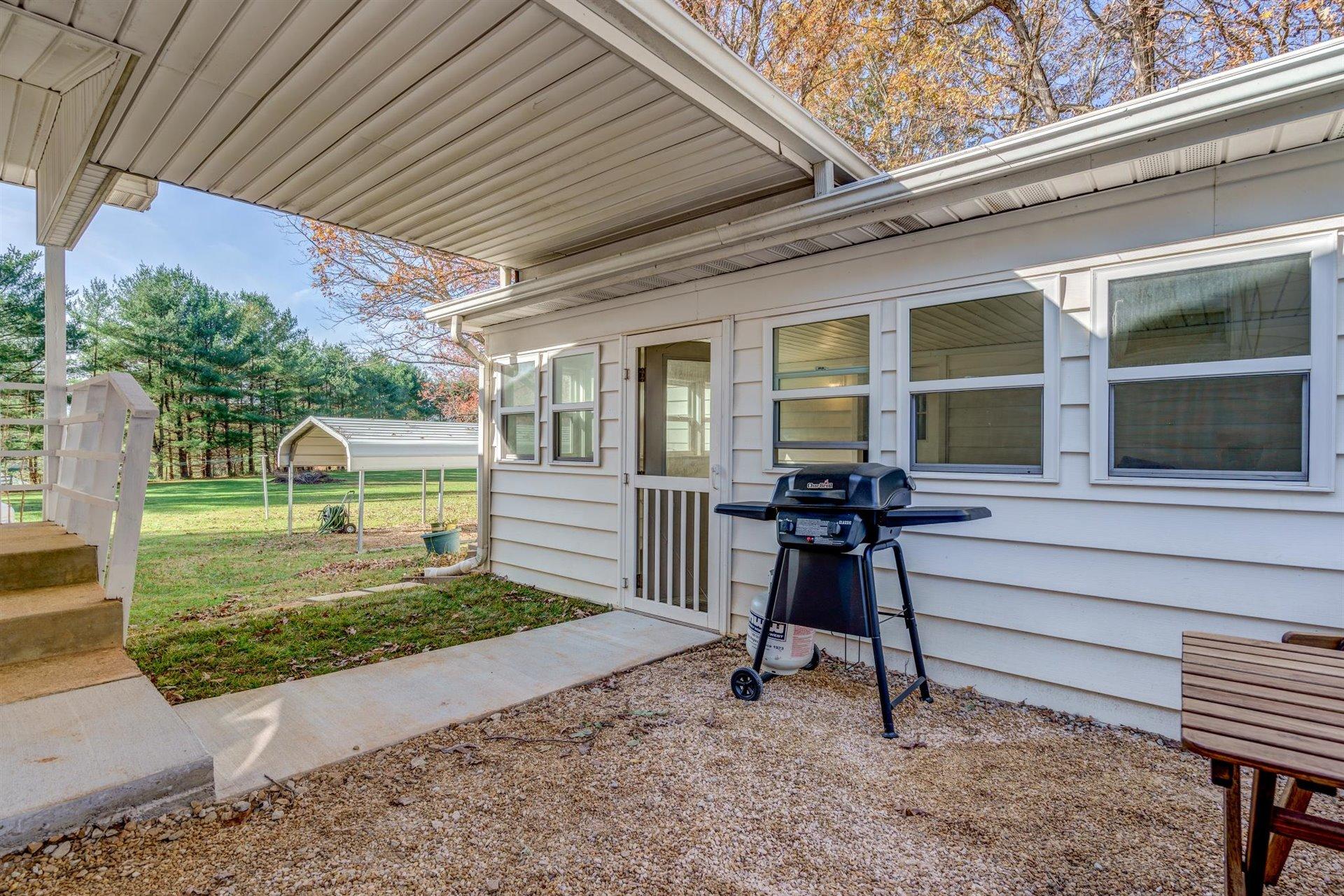 2725 Morgans Mill Road Goodview, VA 24095 - Photo 27 of 49 a view of a house with a porch