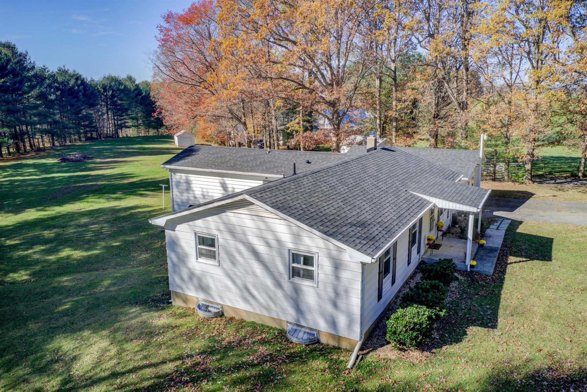 2725 Morgans Mill Road Goodview, VA 24095 - Photo 4 of 49 front view of a house with a yard