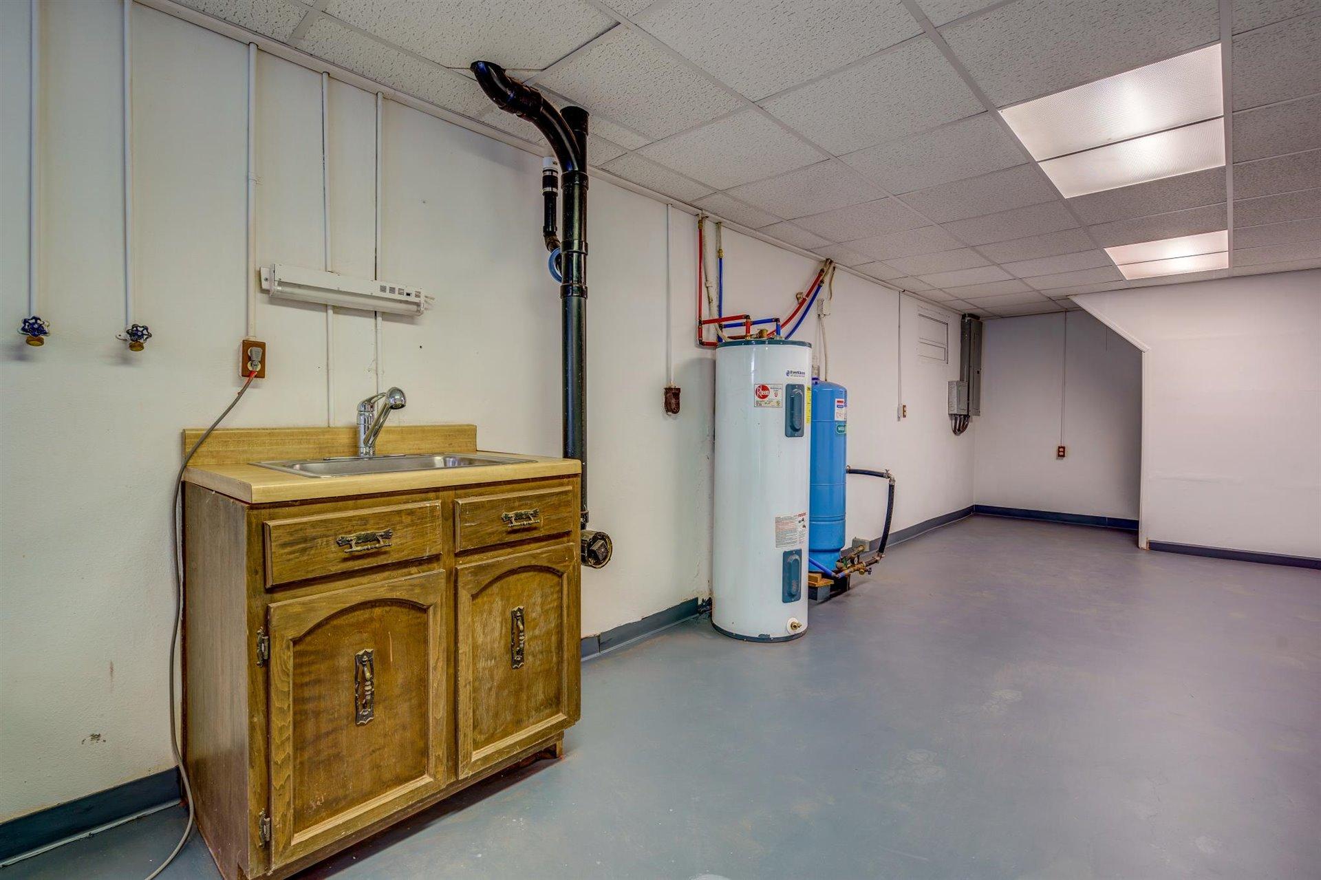 2725 Morgans Mill Road Goodview, VA 24095 - Photo 34 of 49 a view of a storage & utility room with washer and dryer