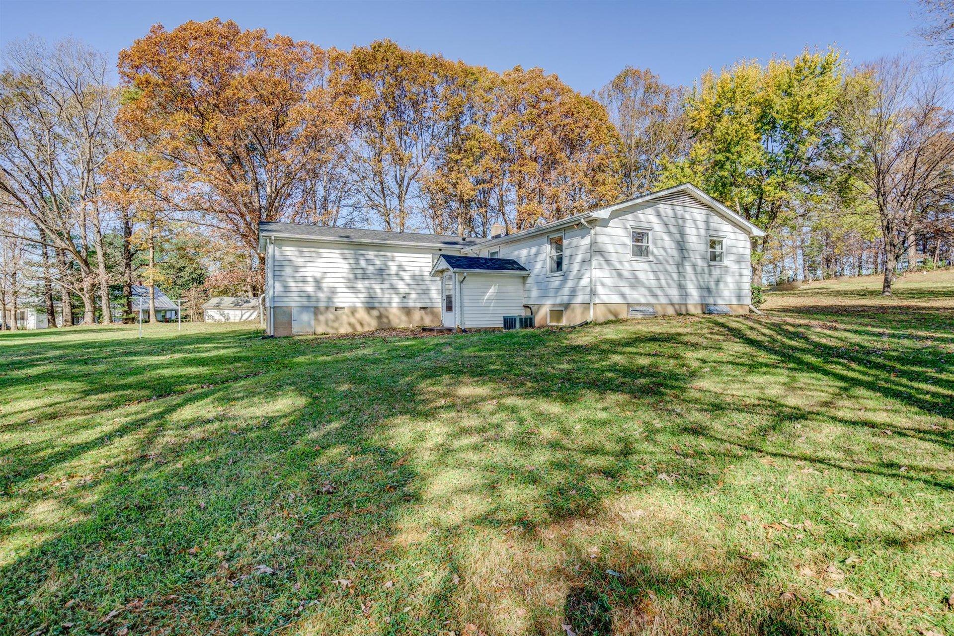 2725 Morgans Mill Road Goodview, VA 24095 - Photo 38 of 49 a view of a house with a yard