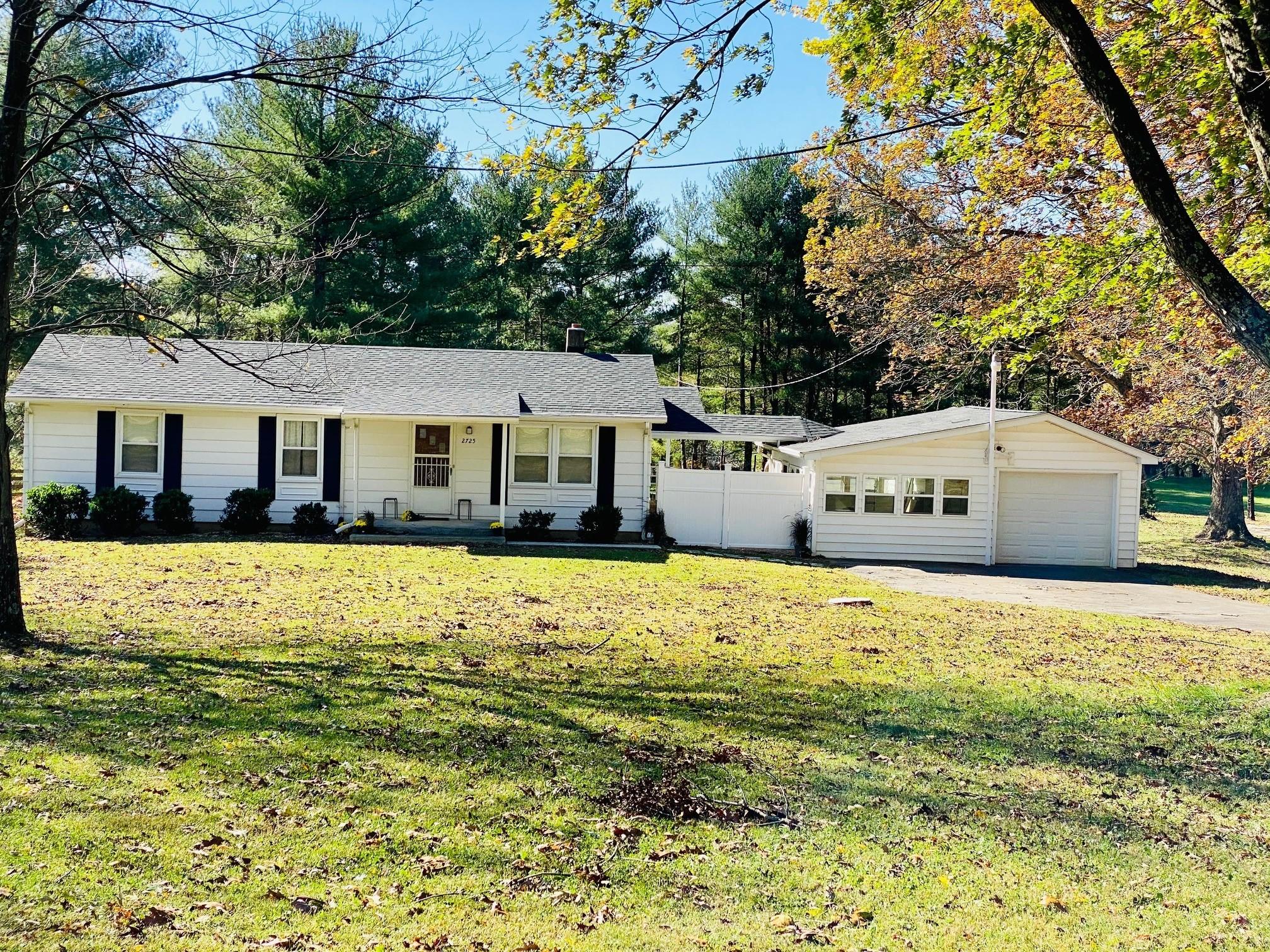 2725 Morgans Mill Road Goodview, VA 24095 - Photo 47 of 49 a front view of a house with a yard