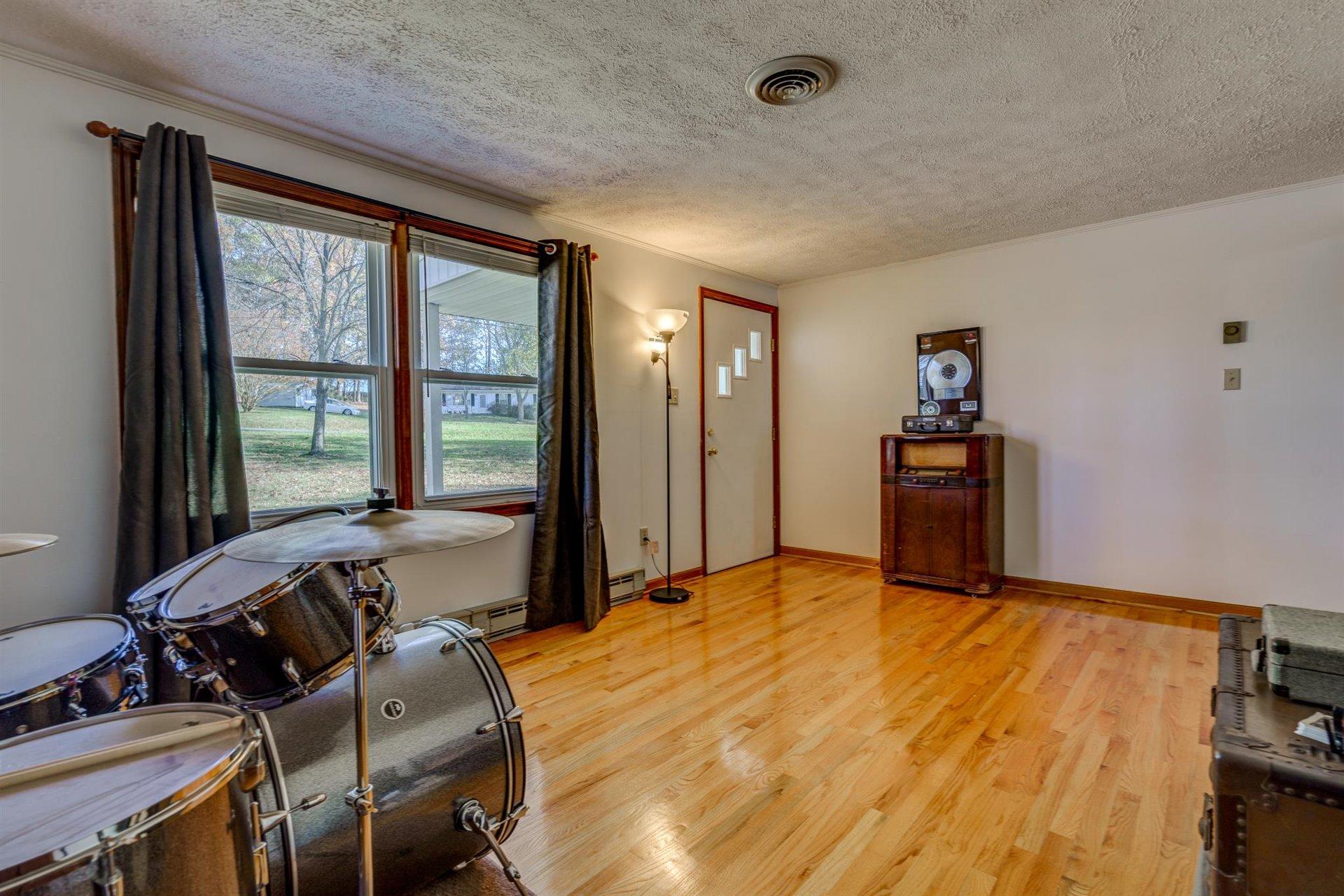 2725 Morgans Mill Road Goodview, VA 24095 - Photo 7 of 49 a view of a livingroom with furniture