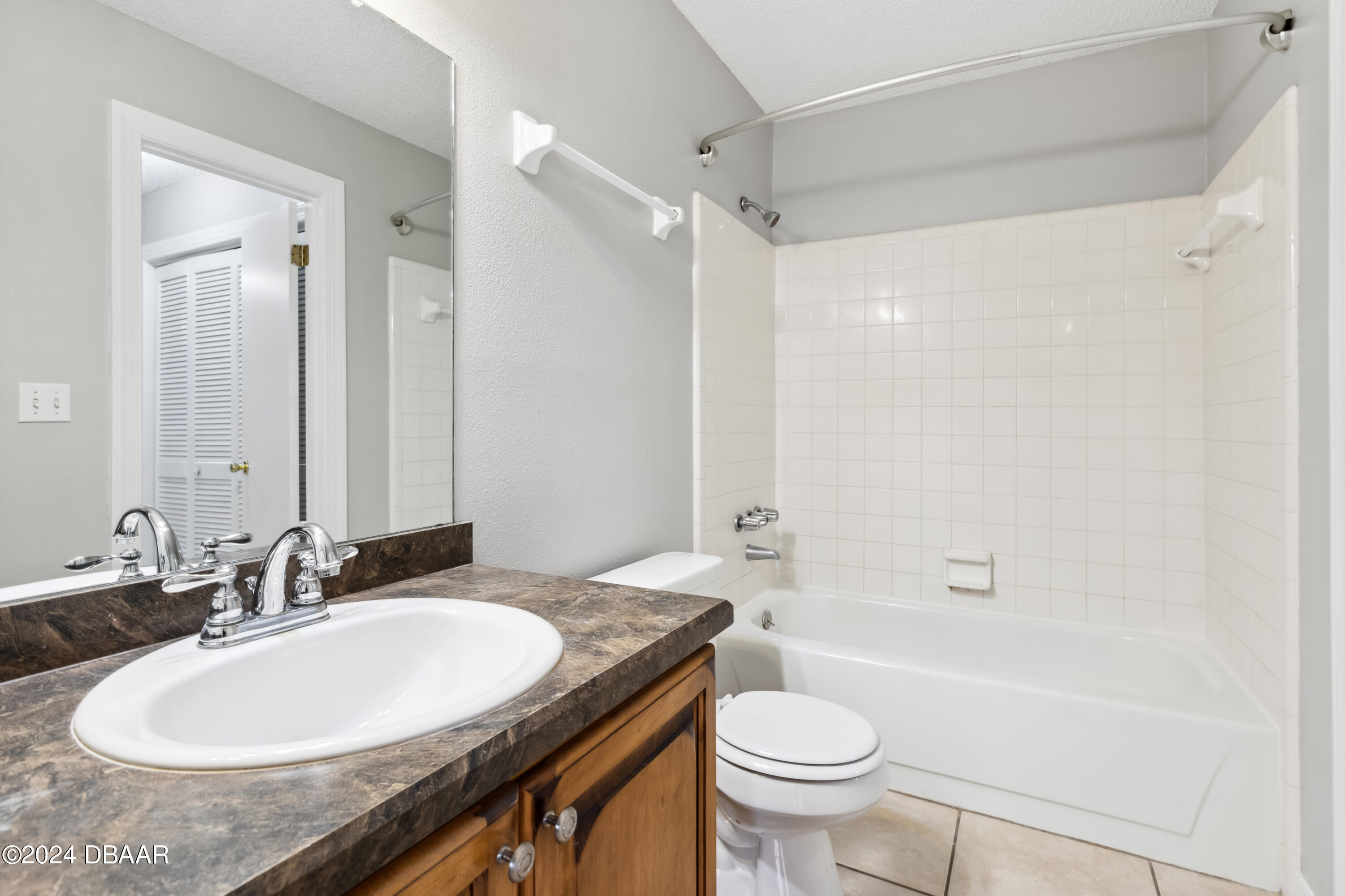 1600 Big Tree Road, Unit K1 South Daytona, FL 32119 - Photo 26 of 28 a bathroom with a granite countertop sink toilet and shower