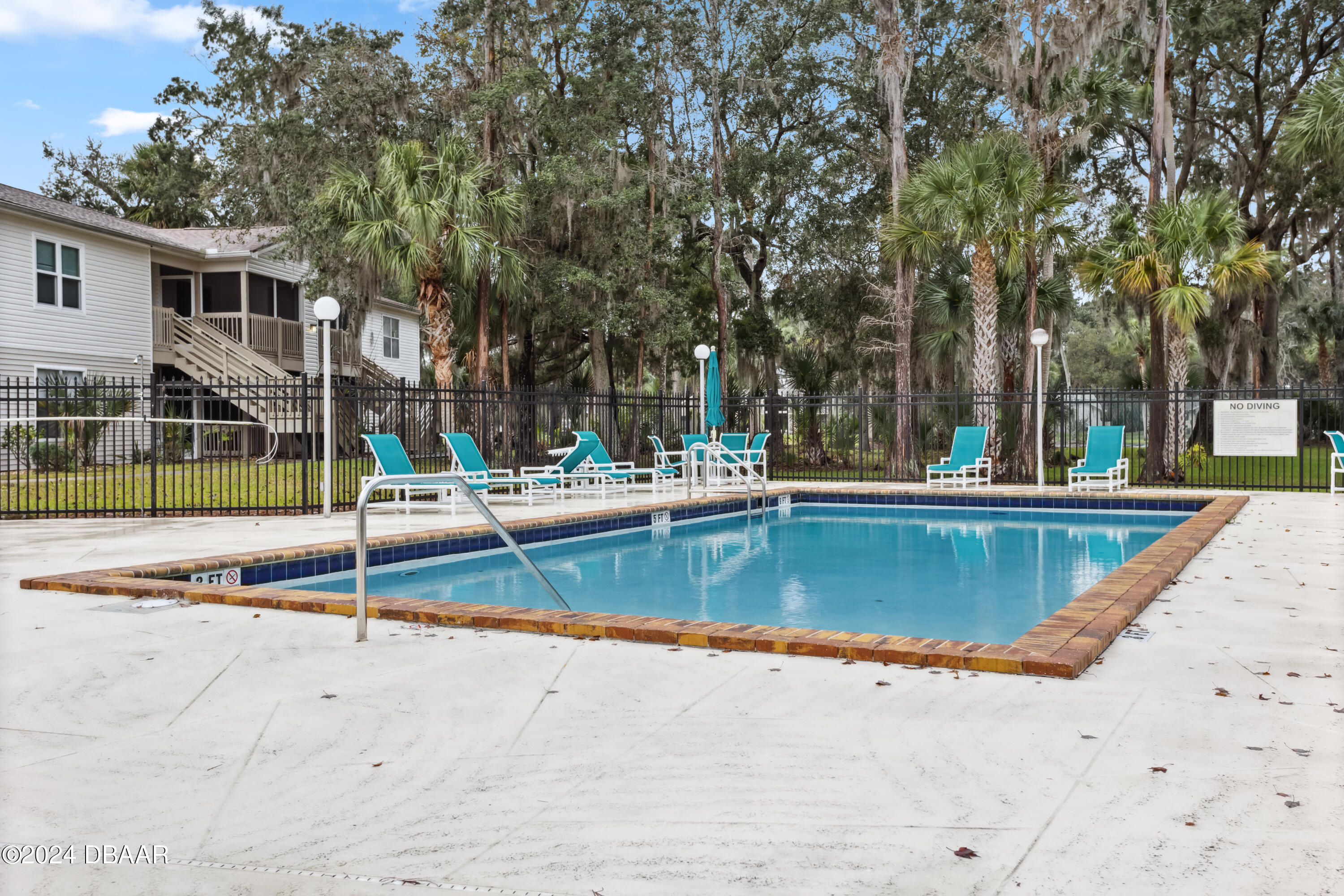 1600 Big Tree Road, Unit K1 South Daytona, FL 32119 - Photo 3 of 28 front view of a house with swimming pool
