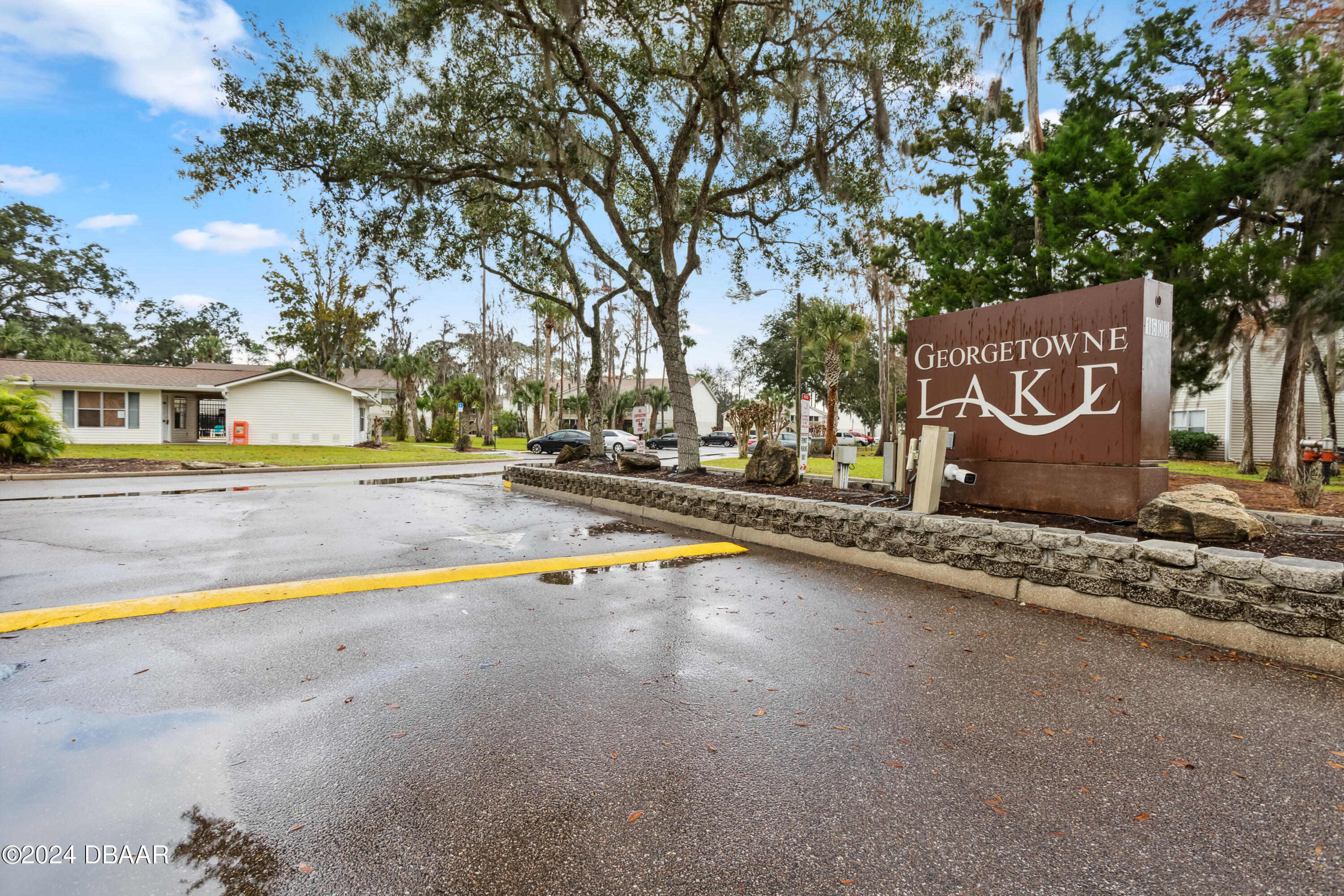 1600 Big Tree Road, Unit K1 South Daytona, FL 32119 - Photo 6 of 28 a view of swimming pool with a yard and large tree