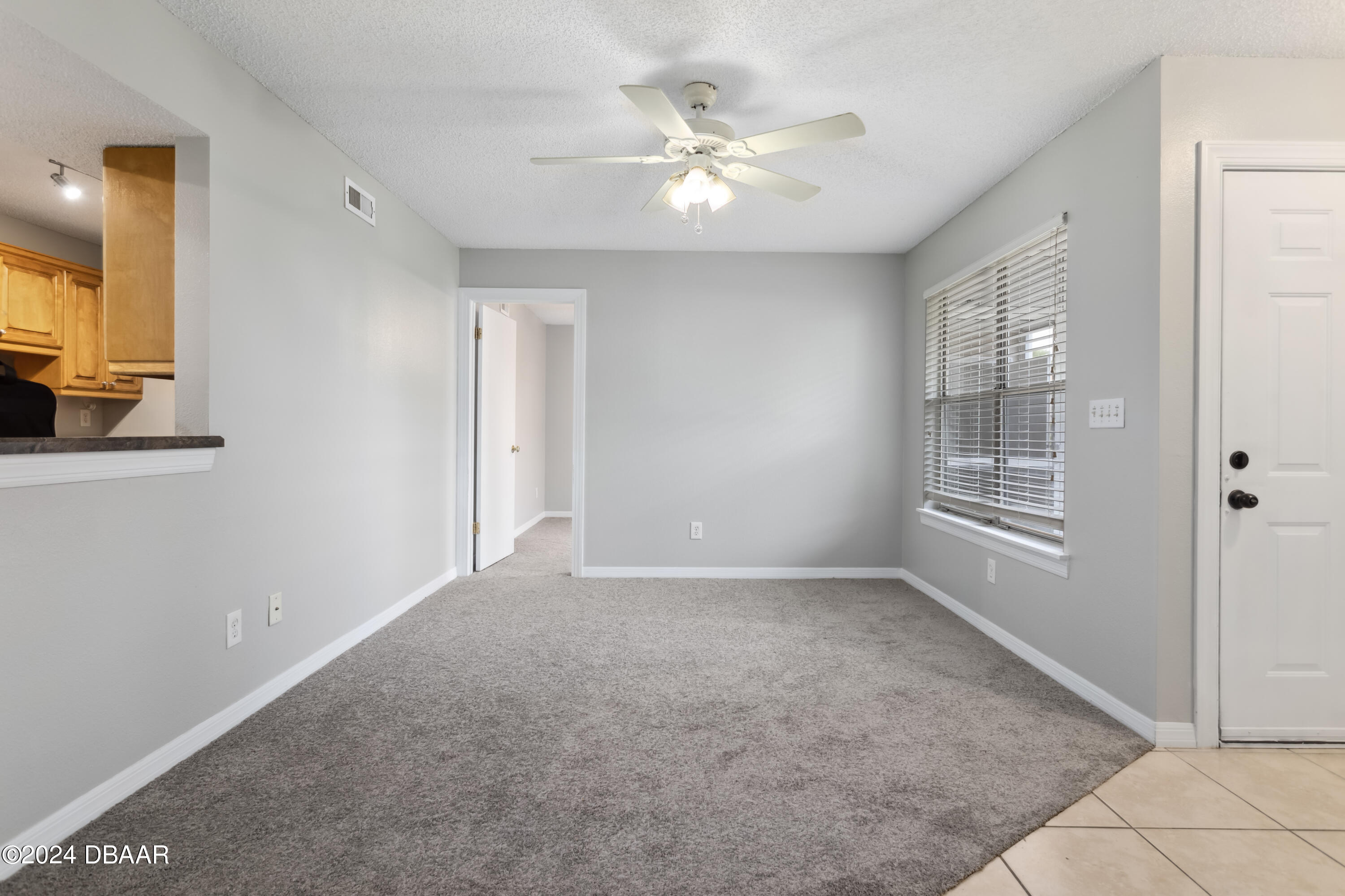 1600 Big Tree Road, Unit K1 South Daytona, FL 32119 - Photo 10 of 28 a view of an empty room with a window