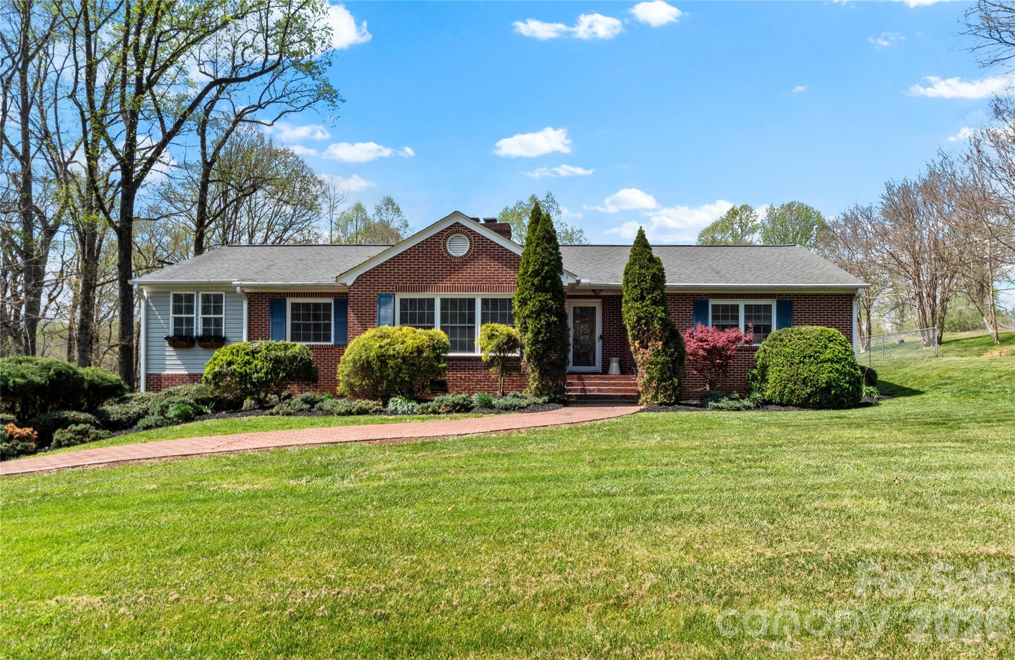 734 Oakland Drive Elkin, NC 28621 - Photo 1 of 48 a front view of a house with a yard