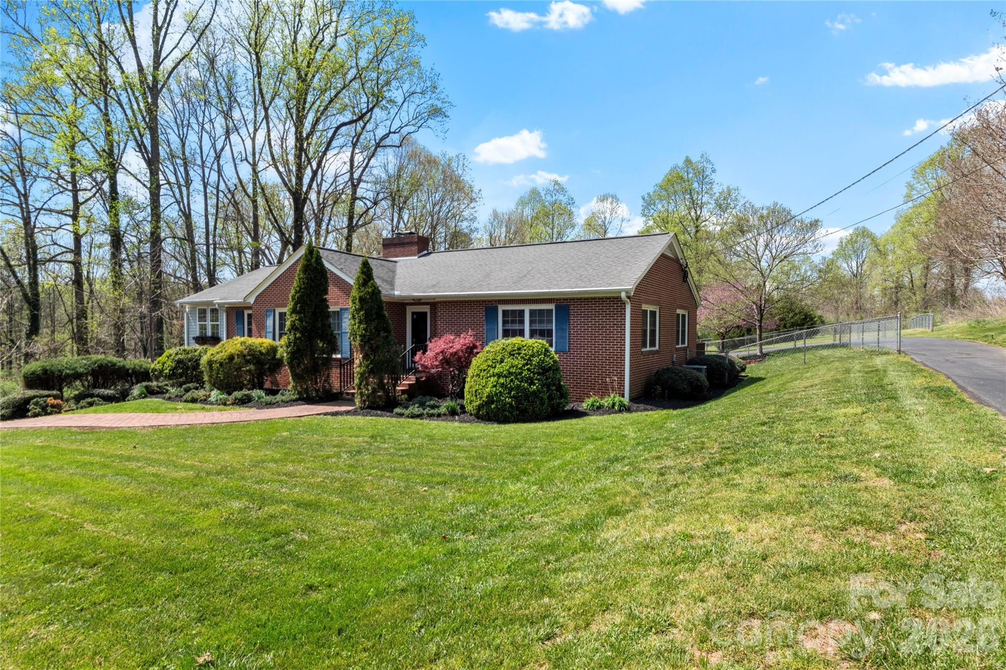 734 Oakland Drive Elkin, NC 28621 - Photo 2 of 48 a view of a house with a yard and garage