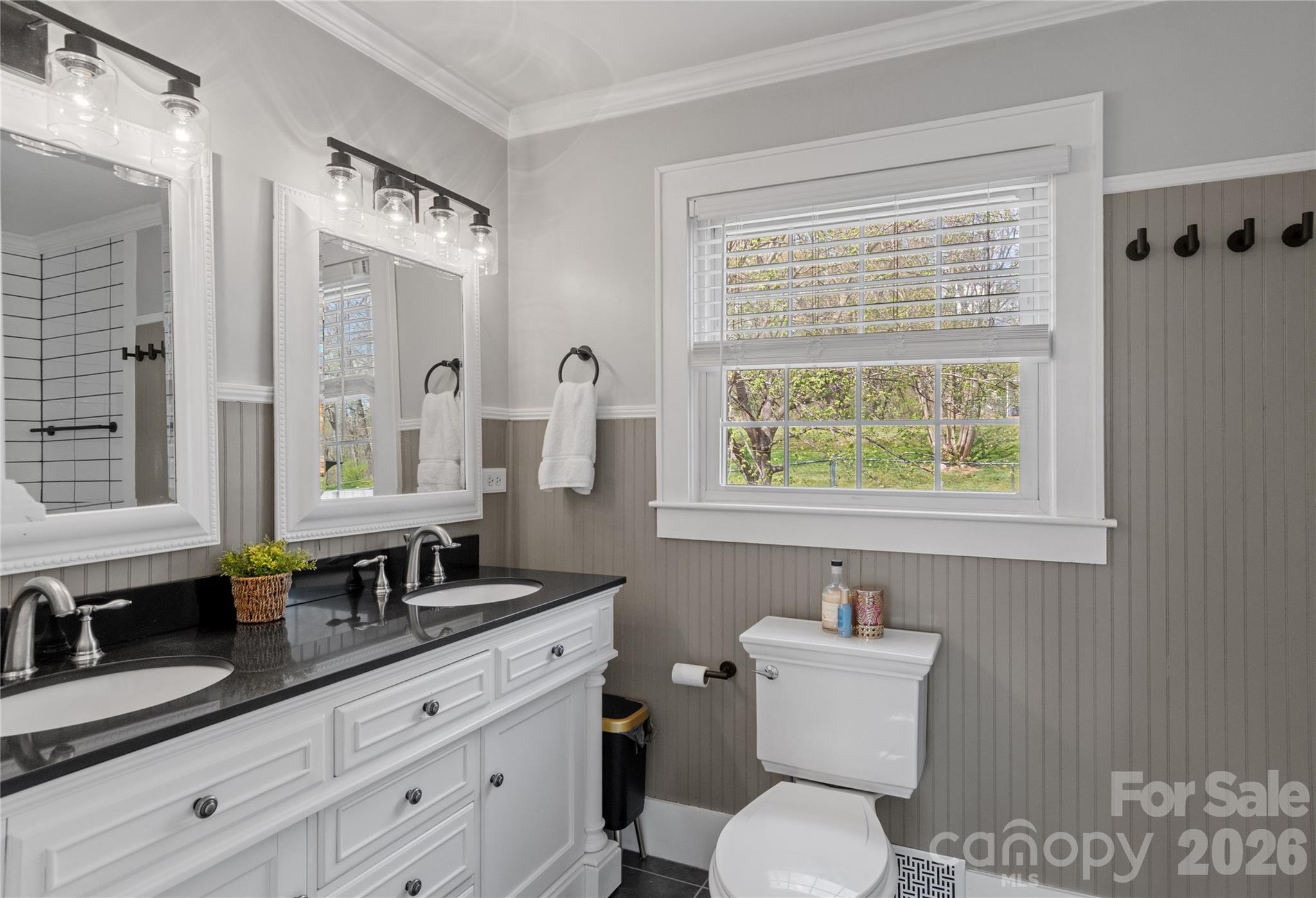 734 Oakland Drive Elkin, NC 28621 - Photo 24 of 48 a bathroom with a toilet a sink and mirror