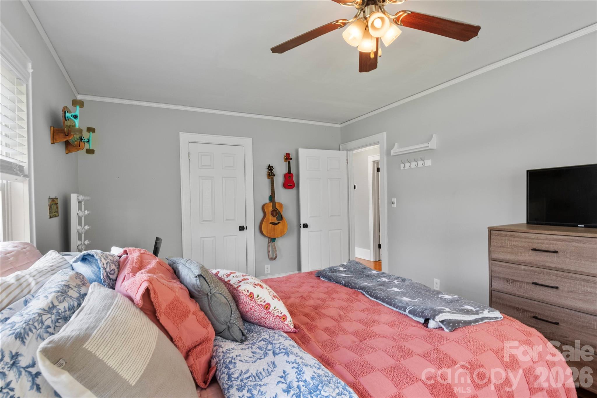 734 Oakland Drive Elkin, NC 28621 - Photo 28 of 48 a bedroom with a bed and a flat tv screen on dresser