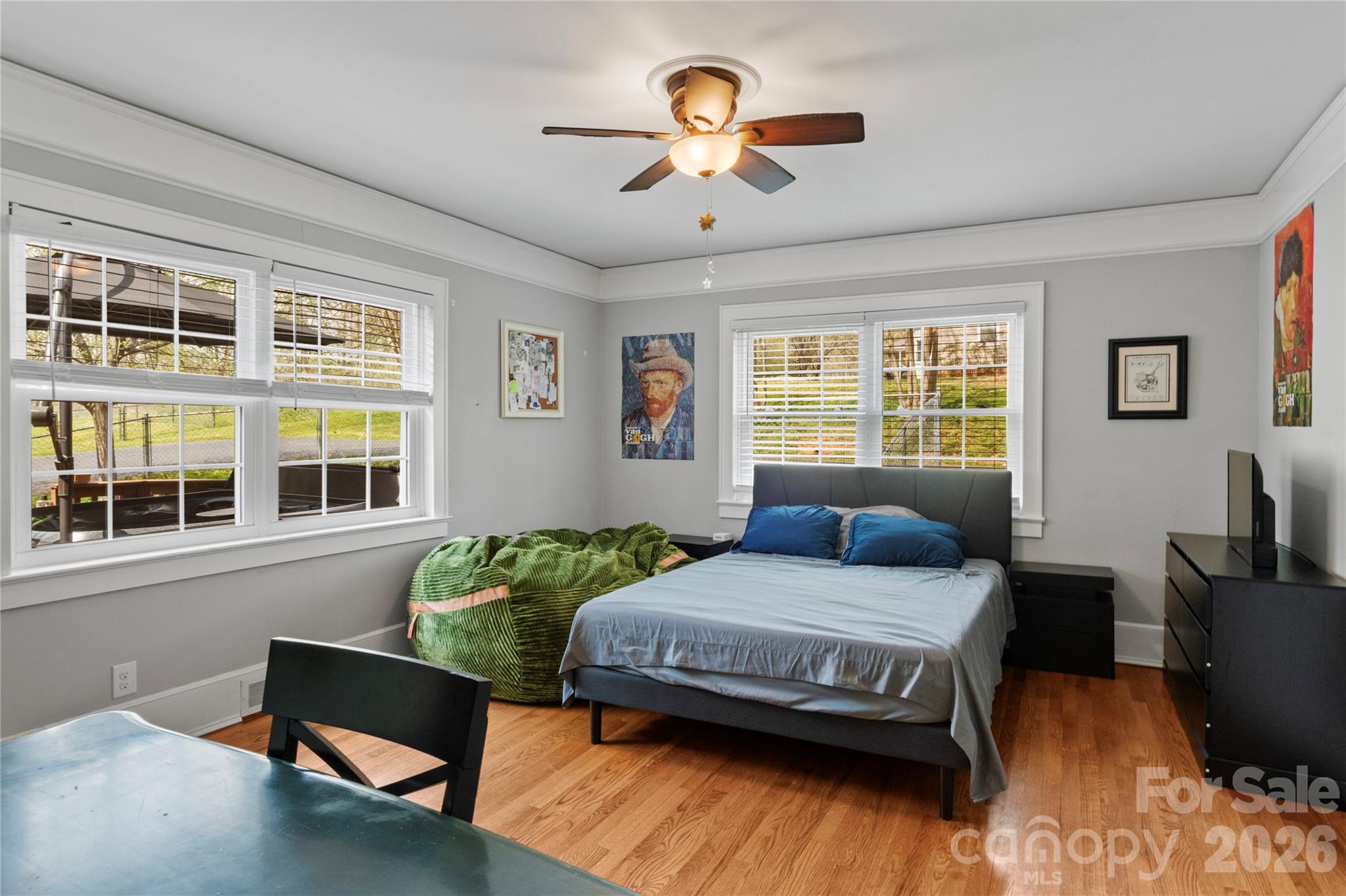 734 Oakland Drive Elkin, NC 28621 - Photo 29 of 48 a bedroom with a bed and wooden floor