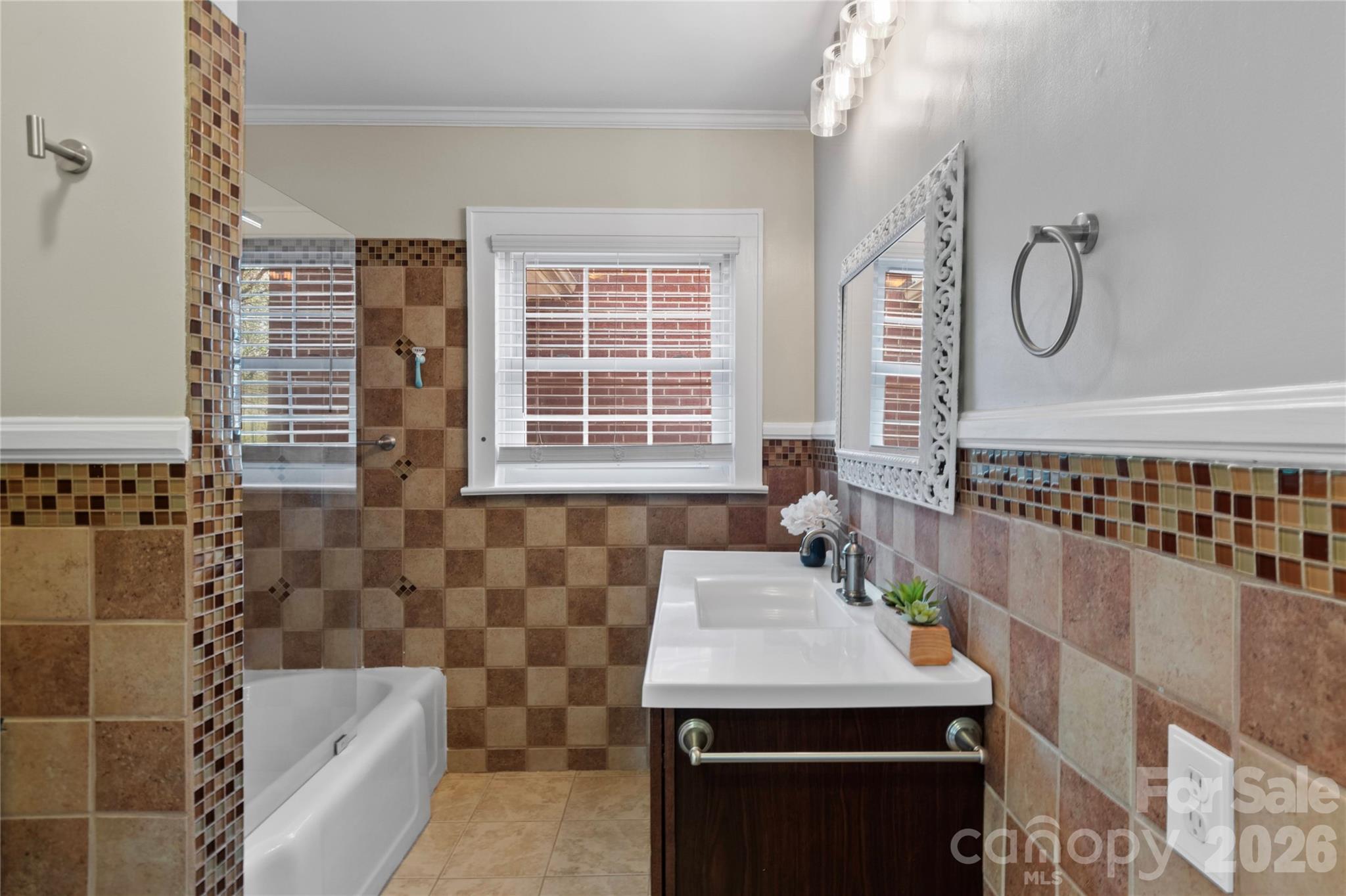 734 Oakland Drive Elkin, NC 28621 - Photo 31 of 48 a bathroom with a sink and a bathtub