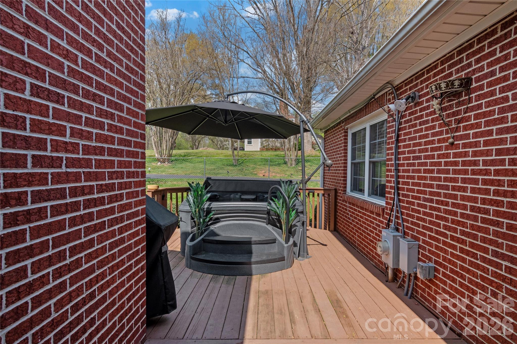 734 Oakland Drive Elkin, NC 28621 - Photo 33 of 48 a view of a balcony with chairs and wooden floor