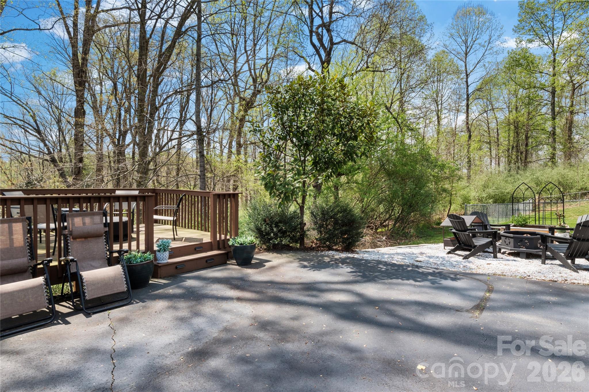 734 Oakland Drive Elkin, NC 28621 - Photo 35 of 48 a view of backyard with outdoor seating and trees