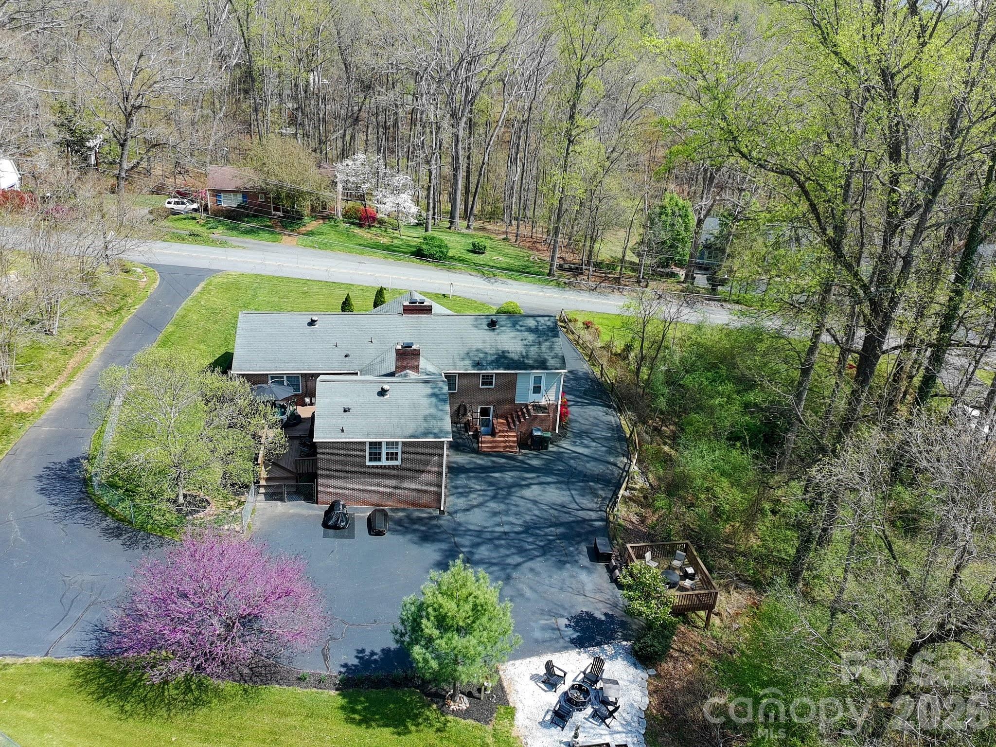 734 Oakland Drive Elkin, NC 28621 - Photo 42 of 48 an aerial view of a house with garden space and street view