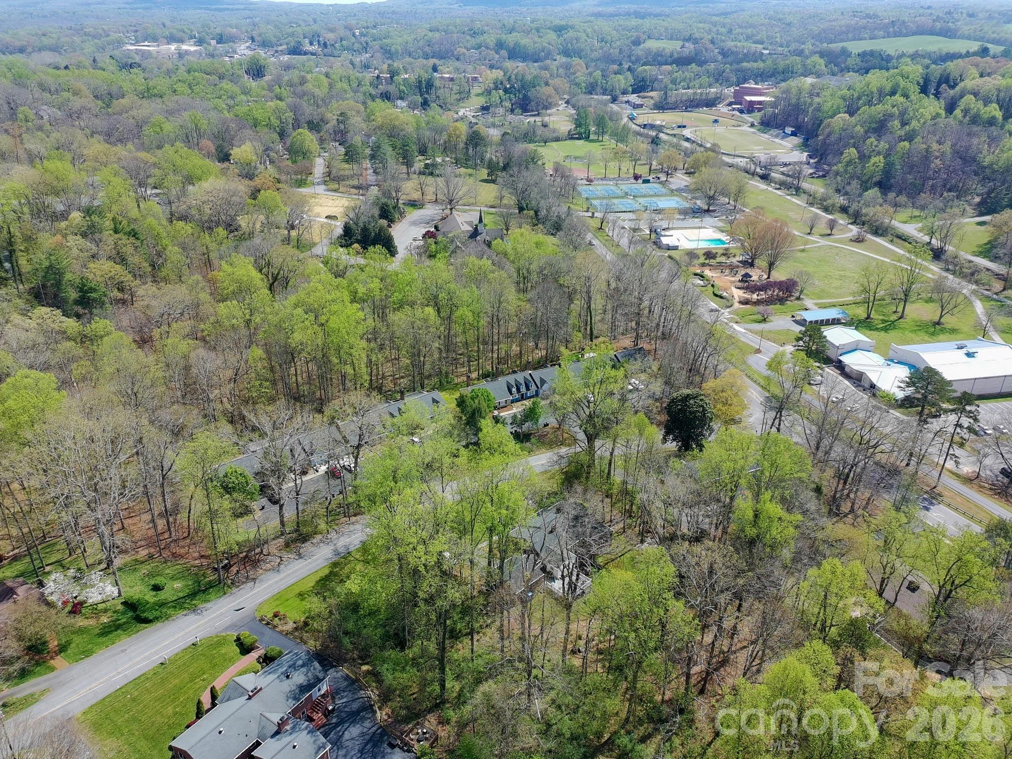 734 Oakland Drive Elkin, NC 28621 - Photo 44 of 48 an aerial view of residential houses with outdoor space and trees