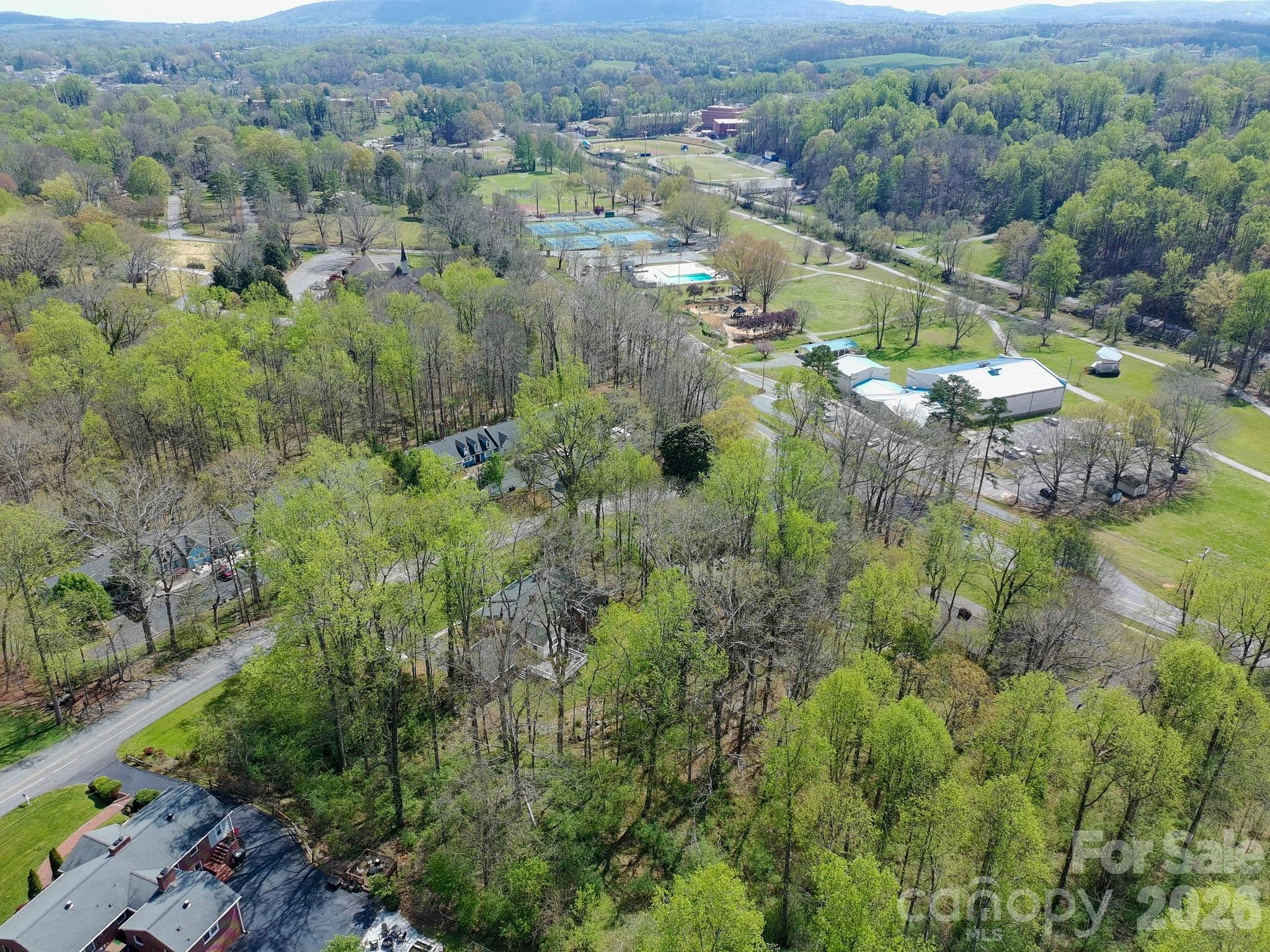 734 Oakland Drive Elkin, NC 28621 - Photo 46 of 48 an aerial view of residential house with outdoor space and trees all around