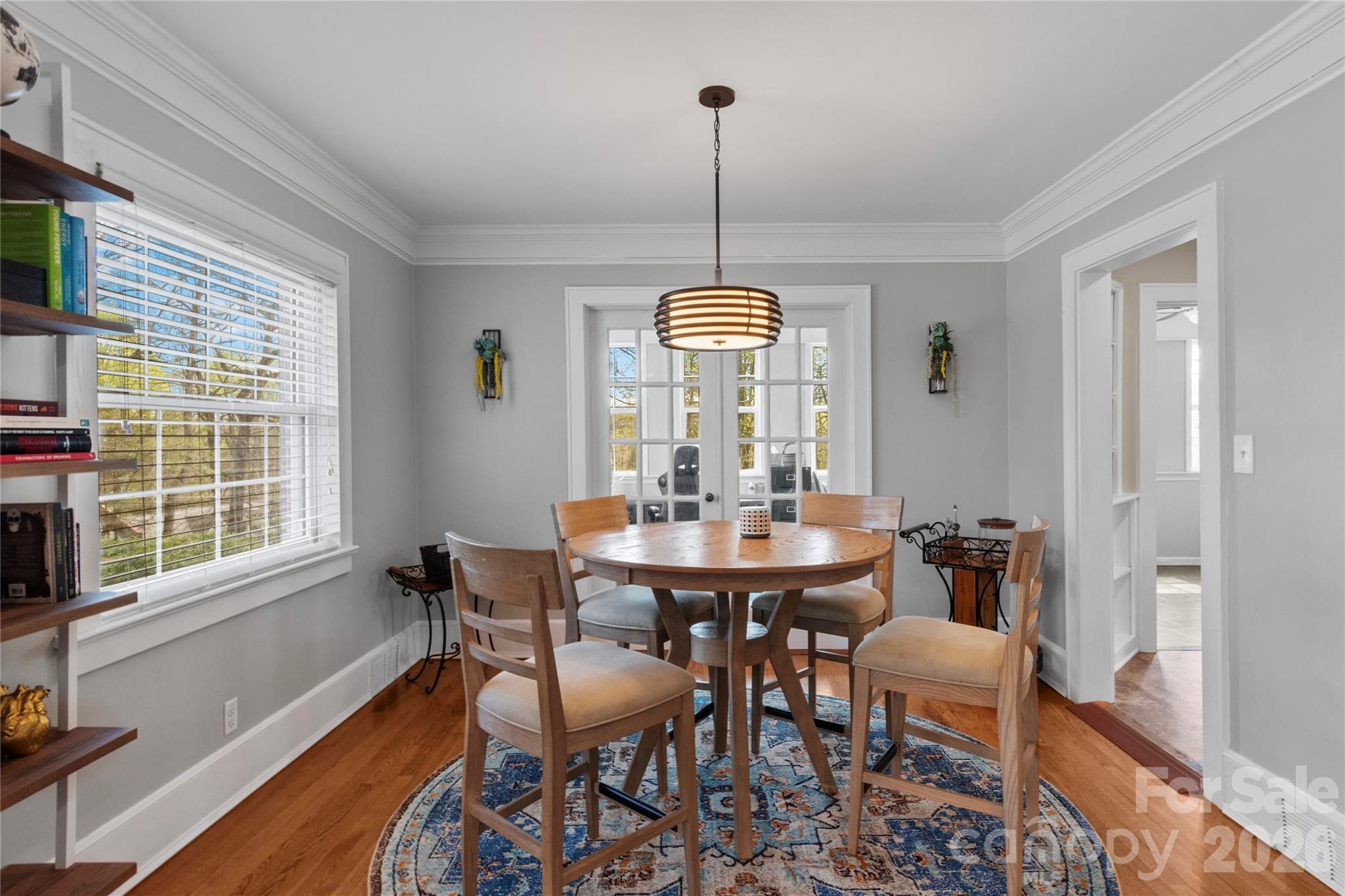 734 Oakland Drive Elkin, NC 28621 - Photo 10 of 48 a view of a dining room with furniture window and wooden floor