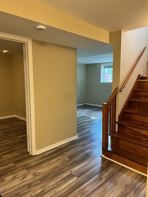1116 Thomas Avenue, Unit G Forest Park, IL 60130 - Photo 6 of 9 a view of a hallway with wooden floor and staircase