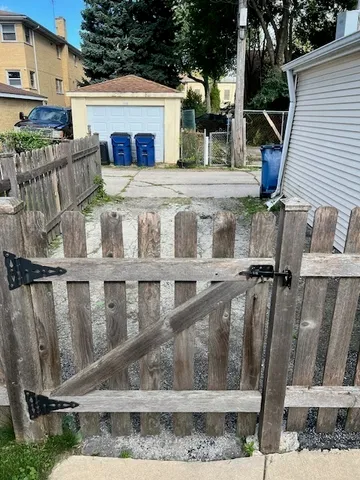a view of a house with a wooden deck