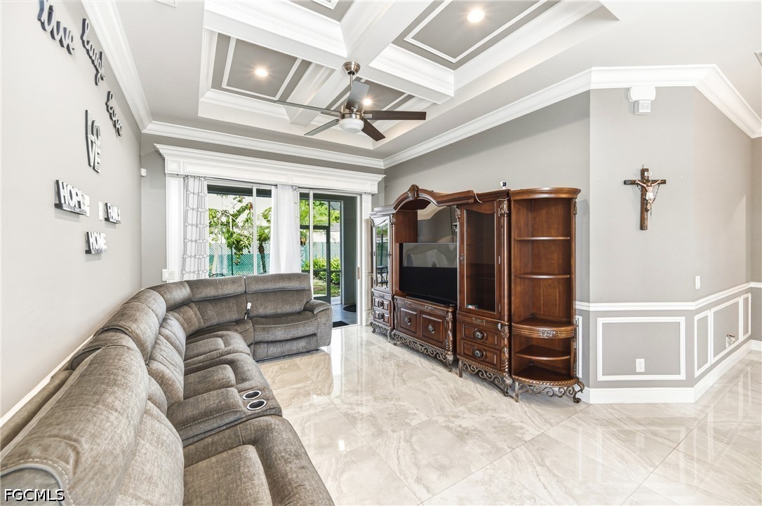 1700 43rd Terrace Southwest Naples, FL 34116 - Photo 23 of 38 a living room with furniture and a flat screen tv