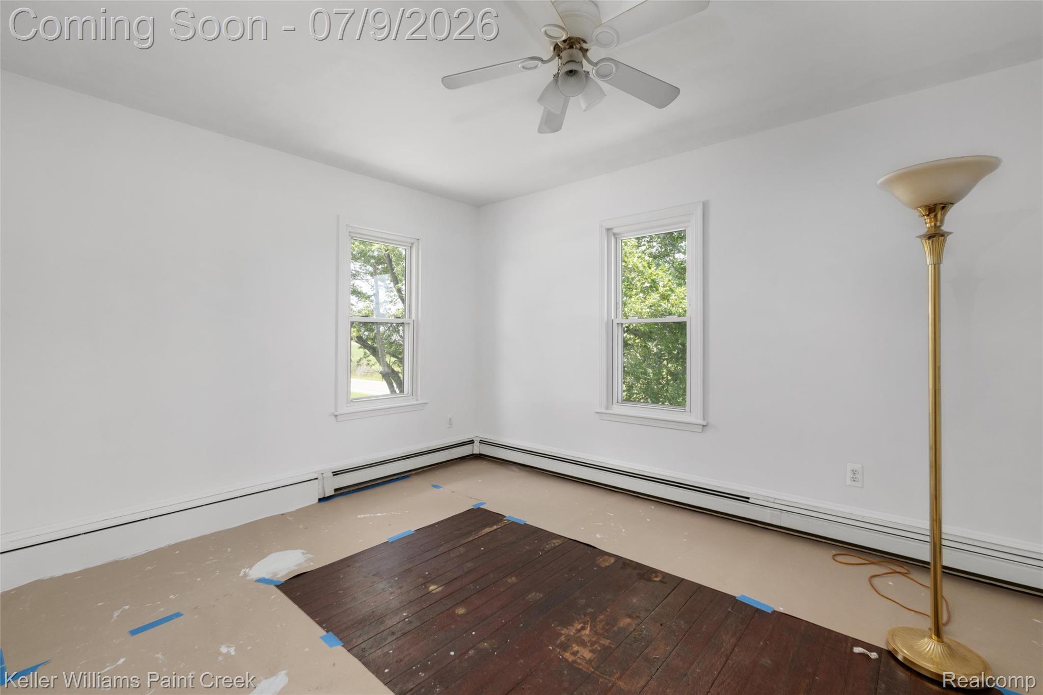 28780 School Section Road Richmond, MI 48062 - Photo 6 of 50 Room featuring dual windows with white trim, a ceiling fan, and baseboard heating