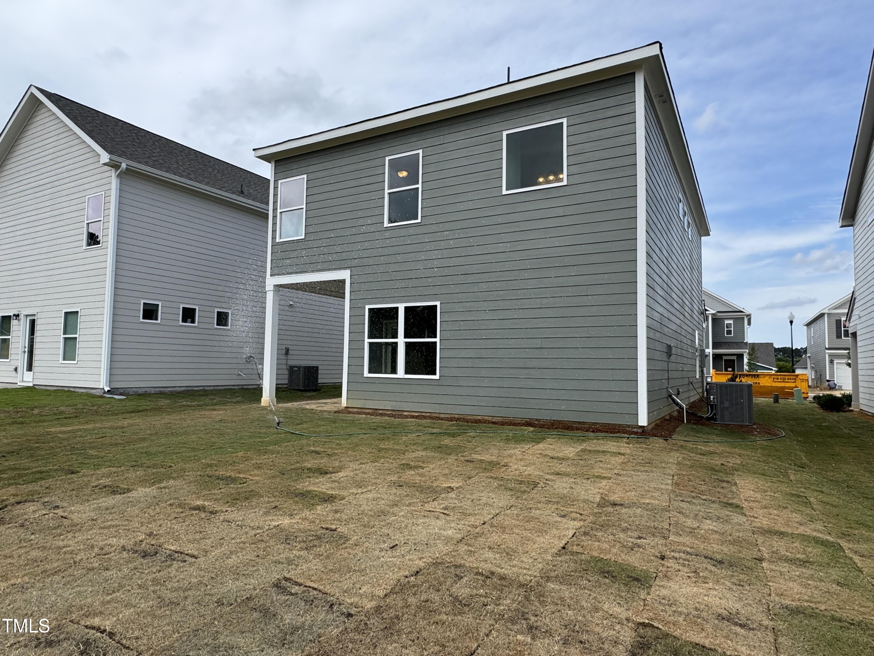 51 Commons Circle Clayton, NC 27520 - Photo 23 of 31 a view of a house with a yard