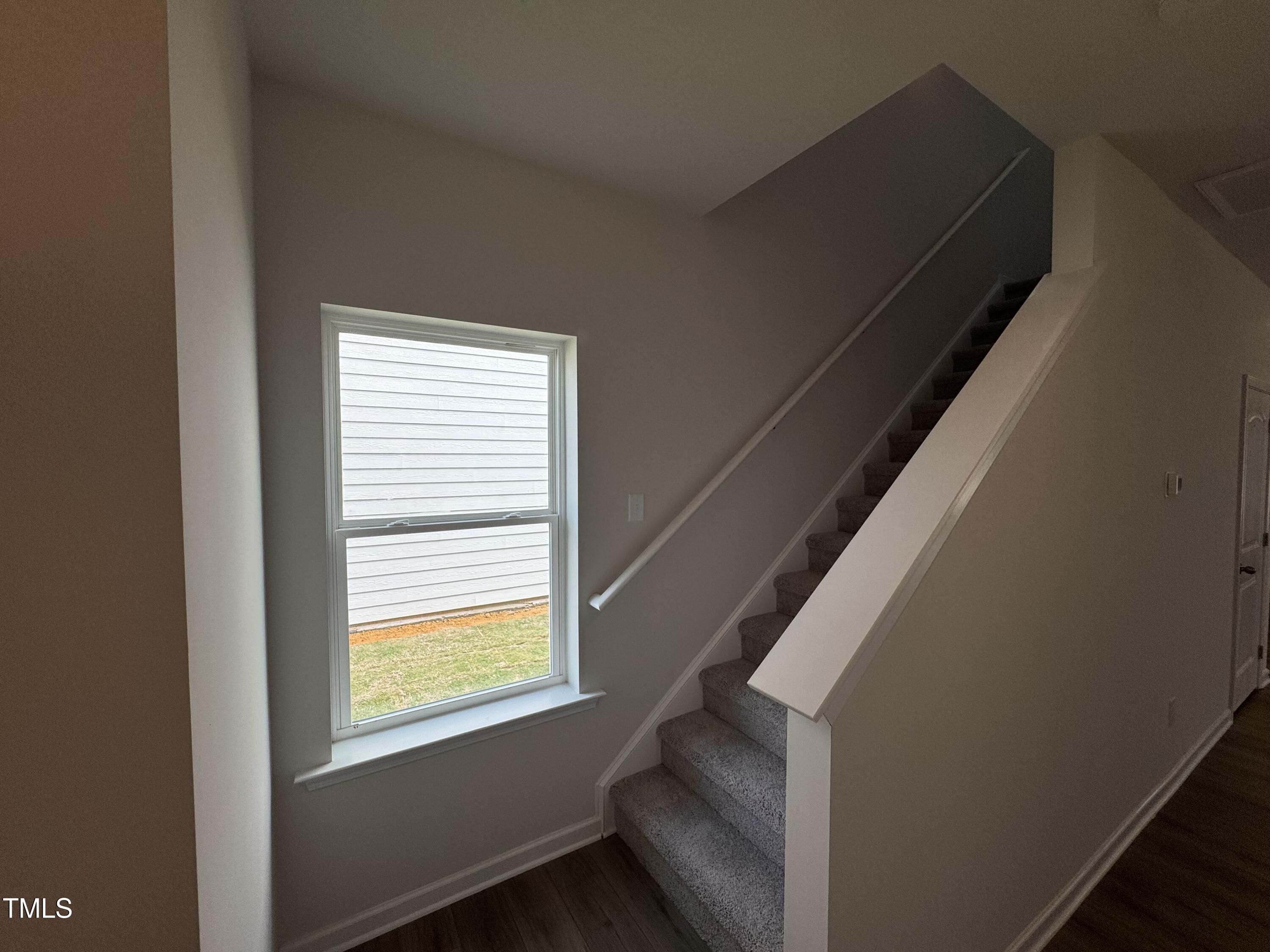 51 Commons Circle Clayton, NC 27520 - Photo 9 of 31 a view of an empty room with a window