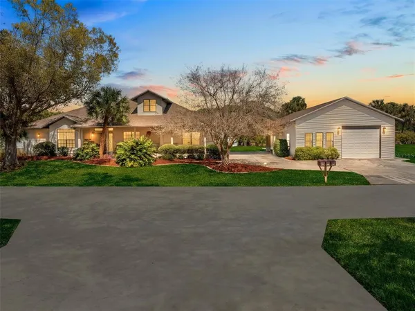 a view of house with yard