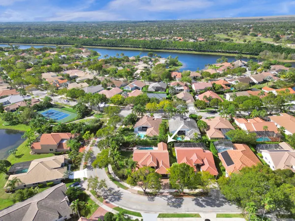 an aerial view of residential building with outdoor space and lake view