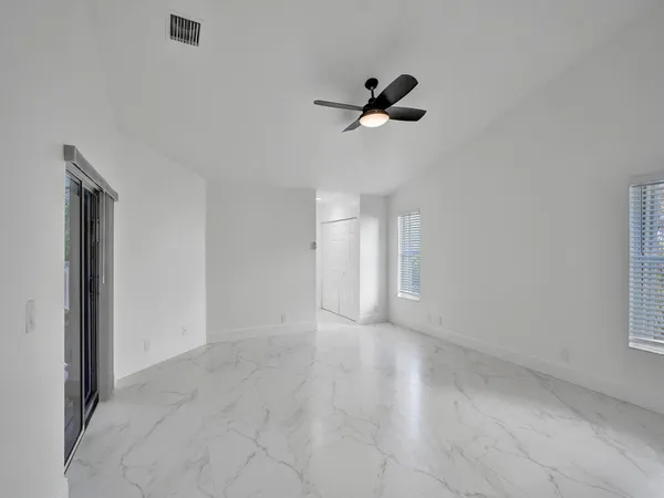 a view of an empty room with a window