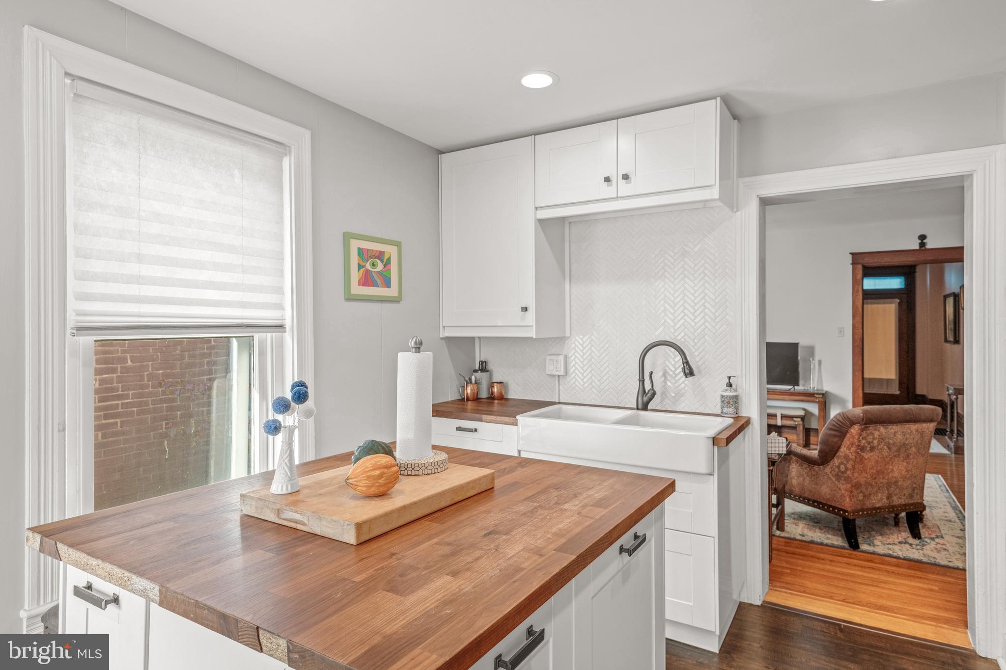156 Front Street Lititz, PA 17543 - Photo 3 of 58 a kitchen with kitchen island a sink table and chairs