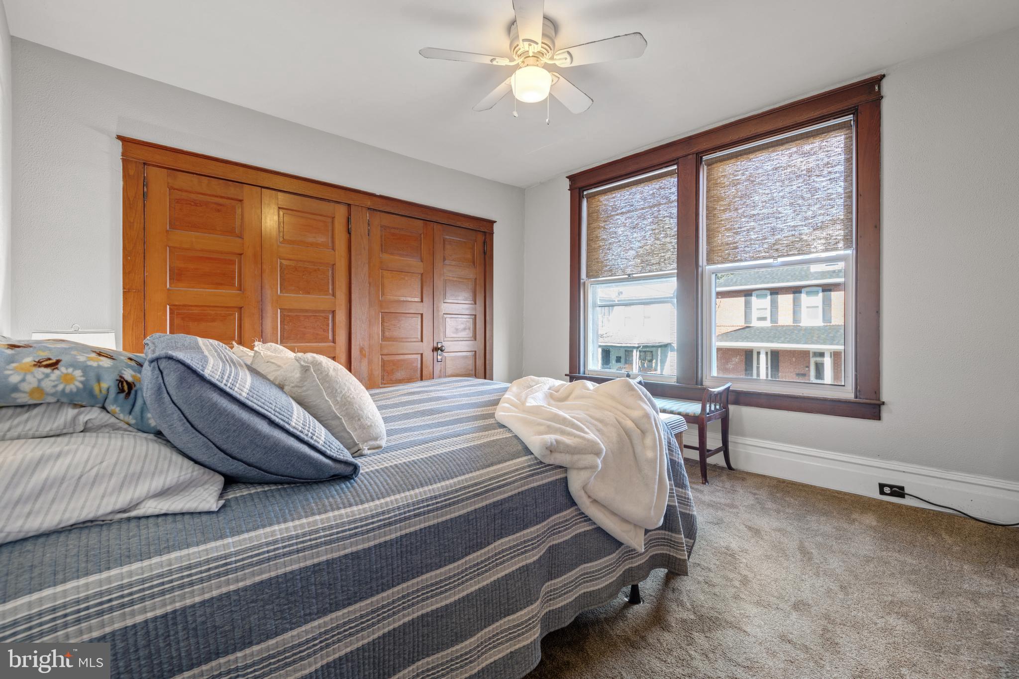 156 Front Street Lititz, PA 17543 - Photo 33 of 58 a bedroom with a bed and a large window