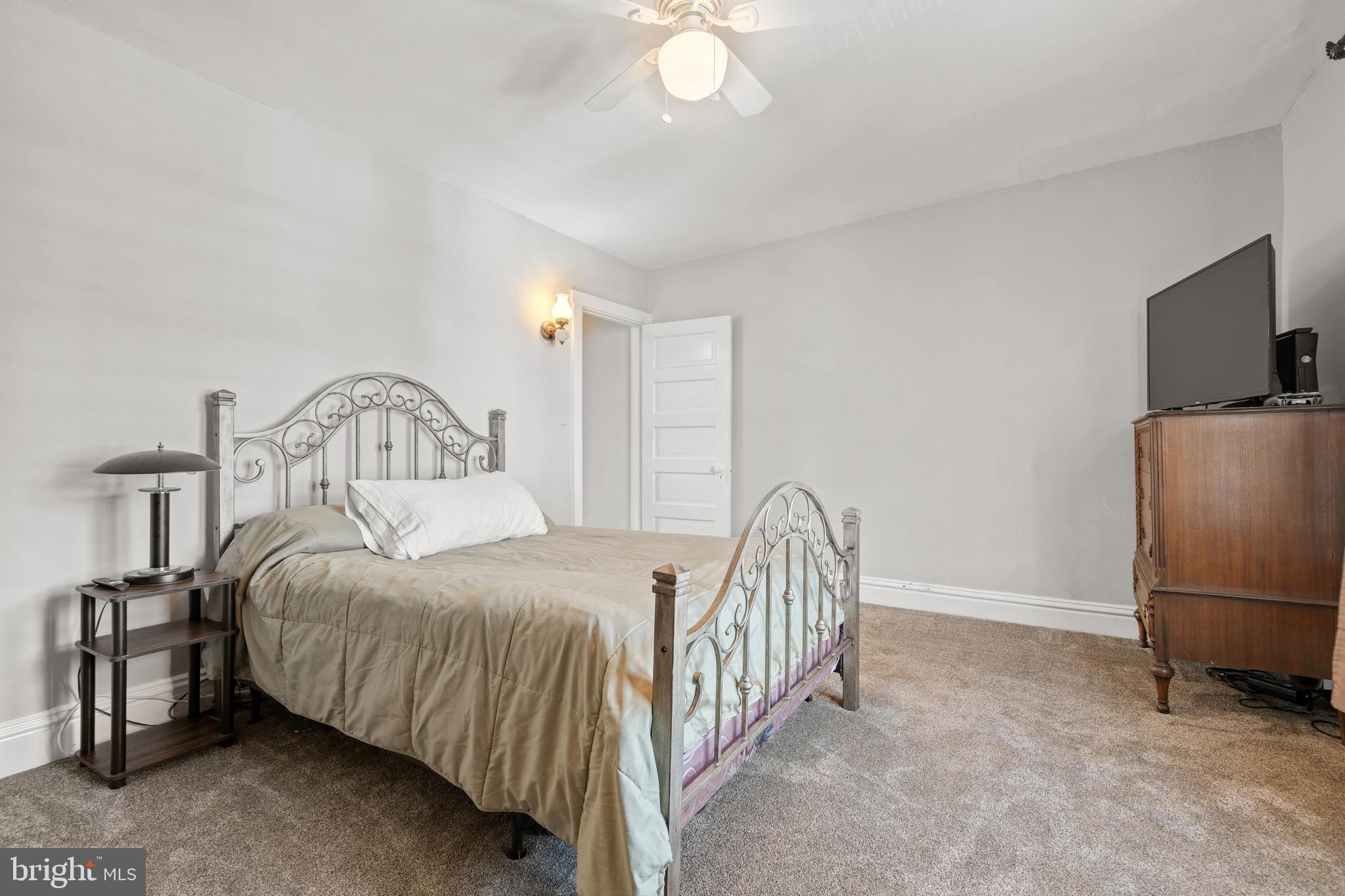 156 Front Street Lititz, PA 17543 - Photo 41 of 58 a bedroom with a bed and a flat screen tv