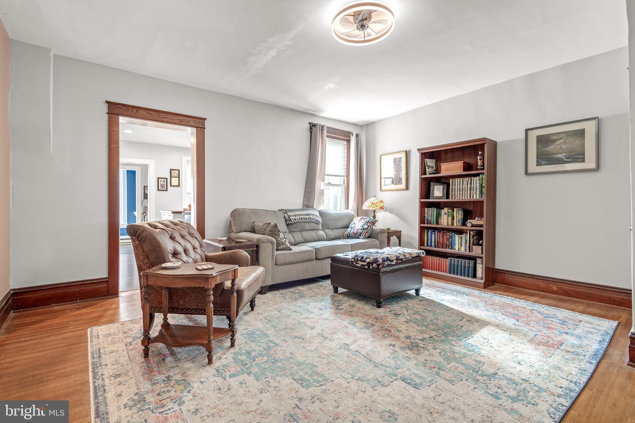 156 Front Street Lititz, PA 17543 - Photo 5 of 58 a living room with furniture and a wooden floor